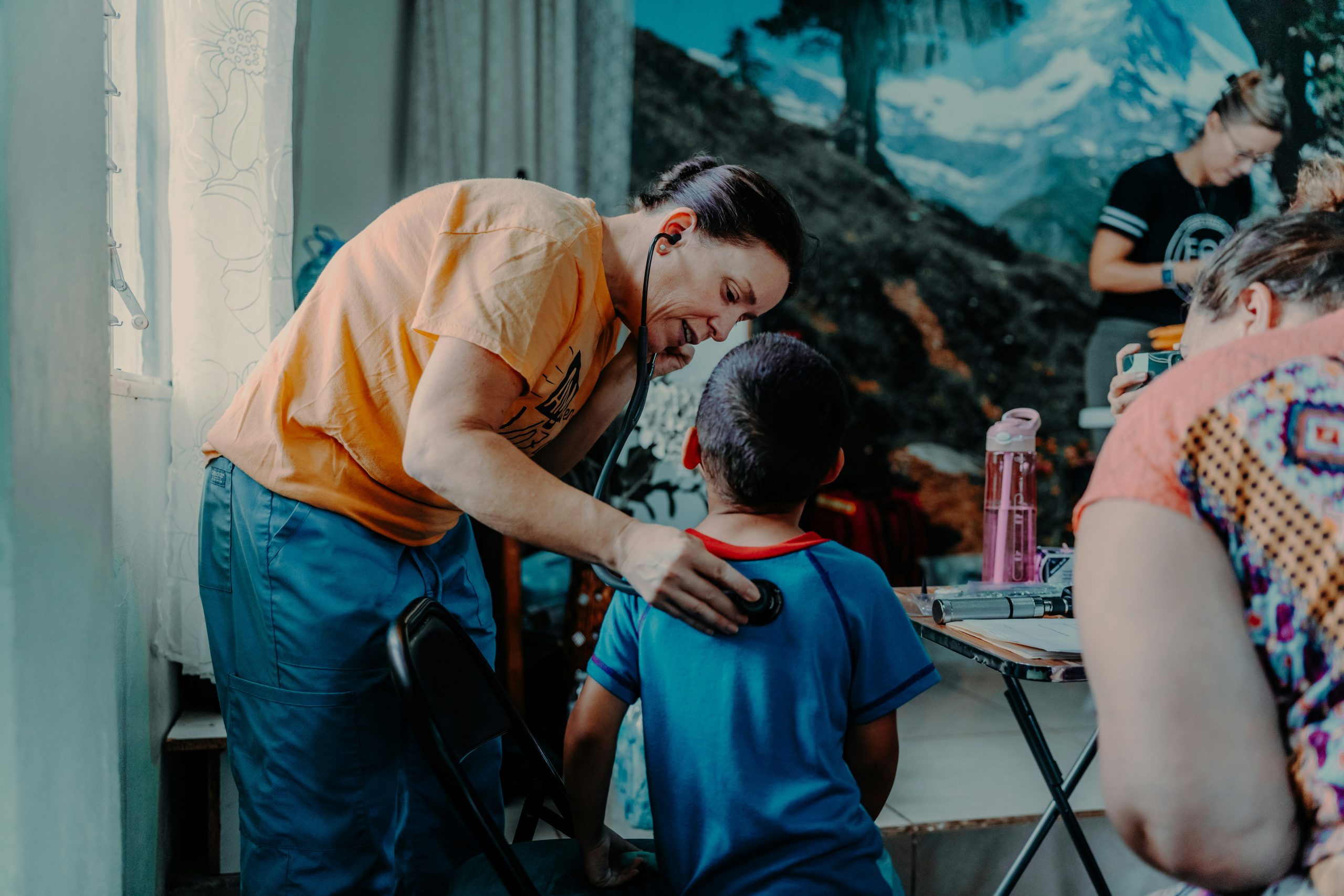 A doctor is examining a child.