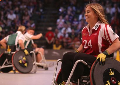 A young woman is playing a wheelchair sport
