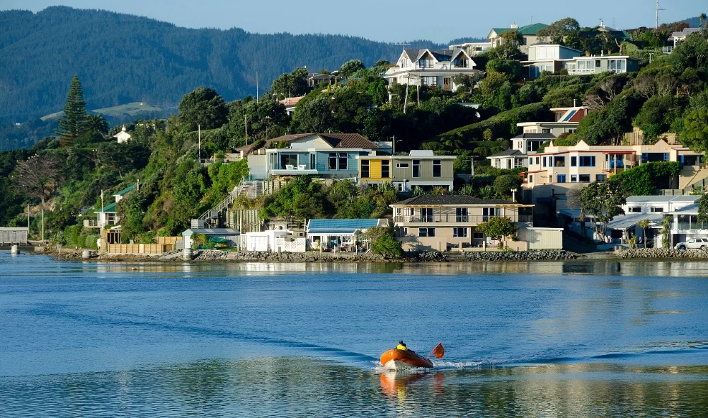 Porirua district with water front and houses on the hill in background